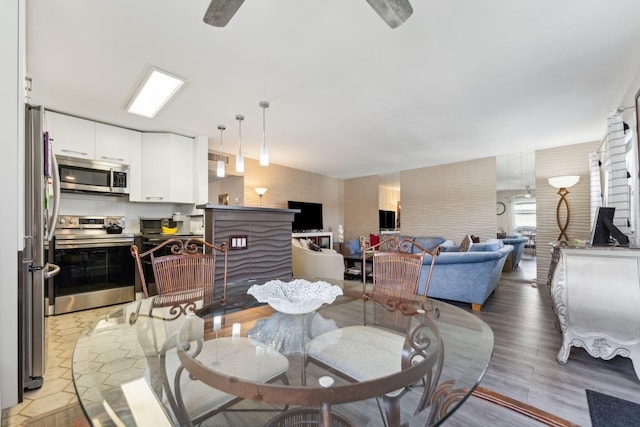 dining space featuring light wood-type flooring