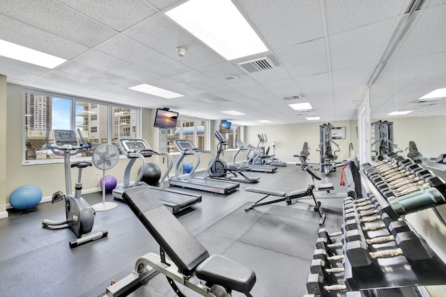 workout area with a paneled ceiling