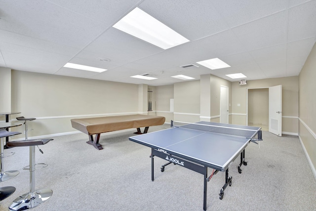 recreation room featuring light carpet