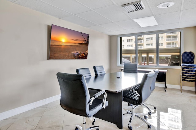 tiled office with a drop ceiling