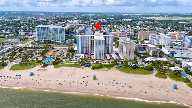 bird's eye view featuring a water view and a view of the beach