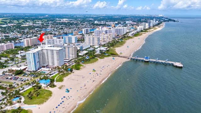 aerial view featuring a view of the beach and a water view