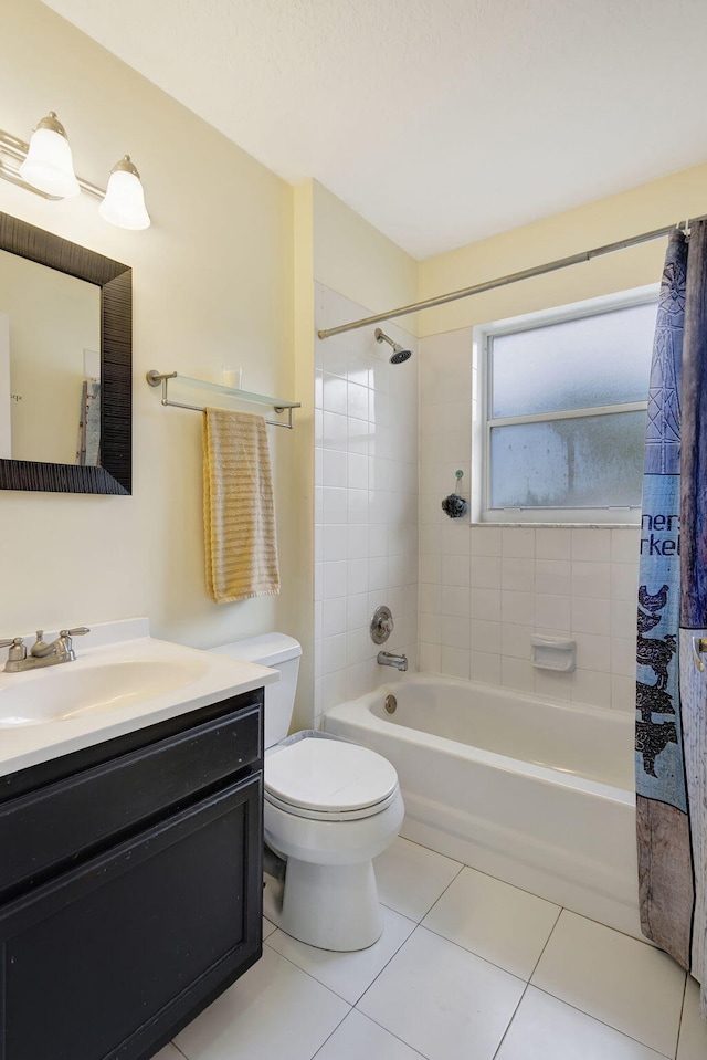 full bathroom featuring vanity, shower / tub combo, toilet, and tile patterned floors