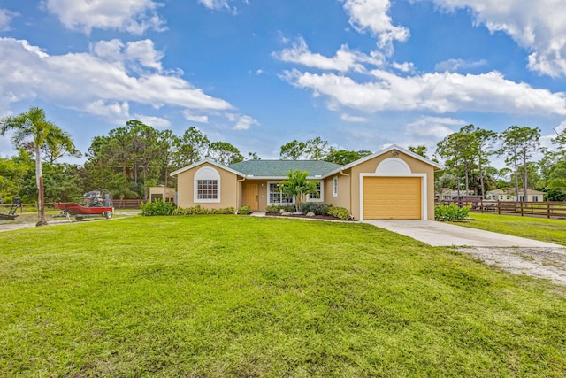 ranch-style home featuring a front yard and a garage