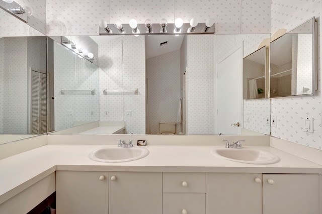 bathroom with vanity, toilet, lofted ceiling, and a shower with door