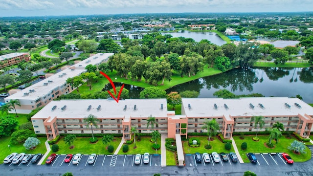 birds eye view of property with a water view