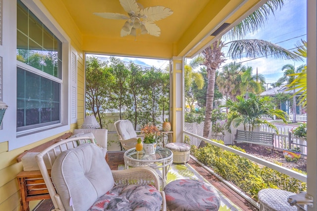 sunroom / solarium with ceiling fan