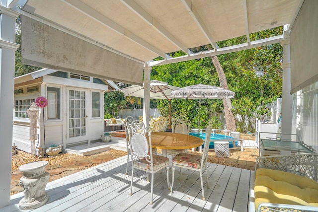 wooden deck featuring an outbuilding