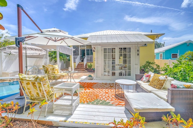 exterior space with french doors and an outdoor structure