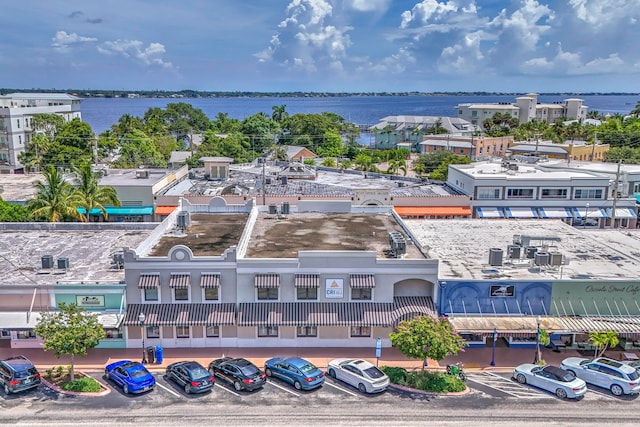 birds eye view of property with a water view