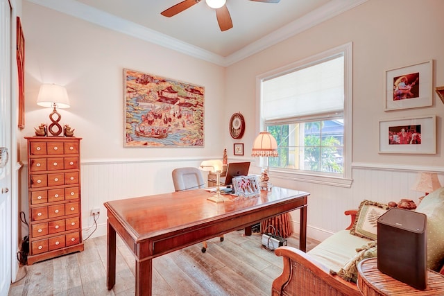 office area with ceiling fan, ornamental molding, and light wood-type flooring