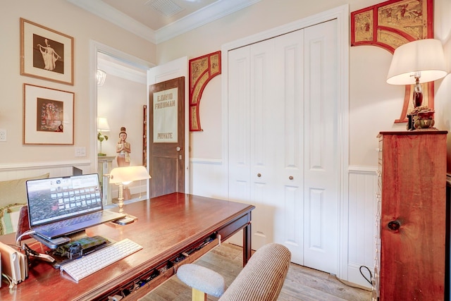 home office with ornamental molding and light wood-type flooring