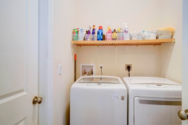 clothes washing area featuring washing machine and clothes dryer