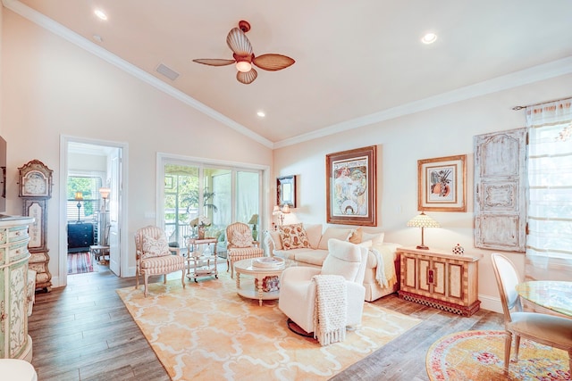 living room featuring crown molding, high vaulted ceiling, light hardwood / wood-style flooring, and ceiling fan