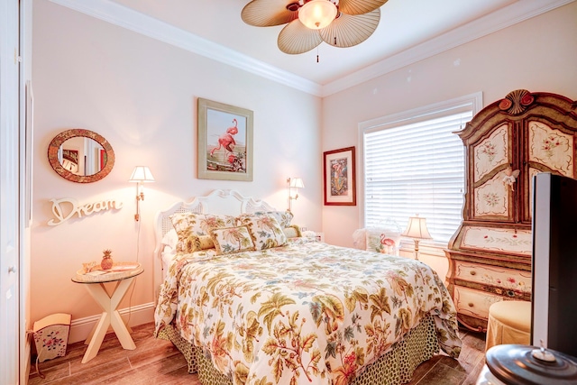 bedroom with crown molding, wood-type flooring, and ceiling fan