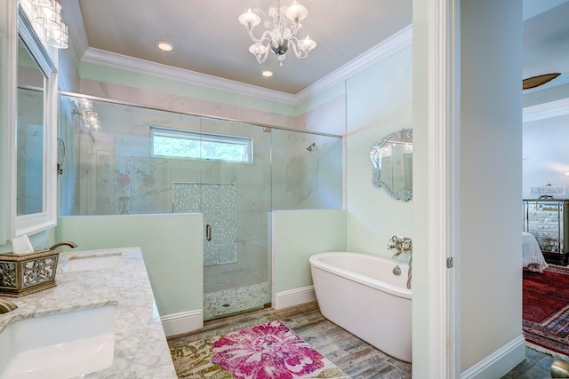 bathroom featuring vanity, separate shower and tub, crown molding, and wood-type flooring