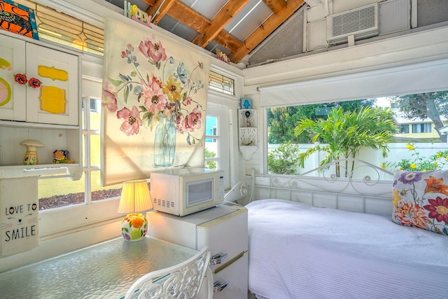 bedroom featuring vaulted ceiling with beams