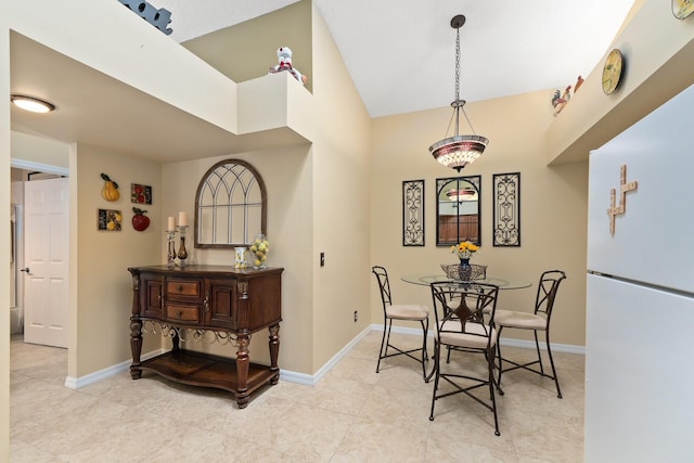 dining area with lofted ceiling