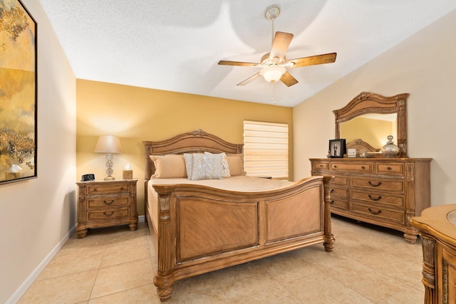 tiled bedroom featuring a textured ceiling and ceiling fan