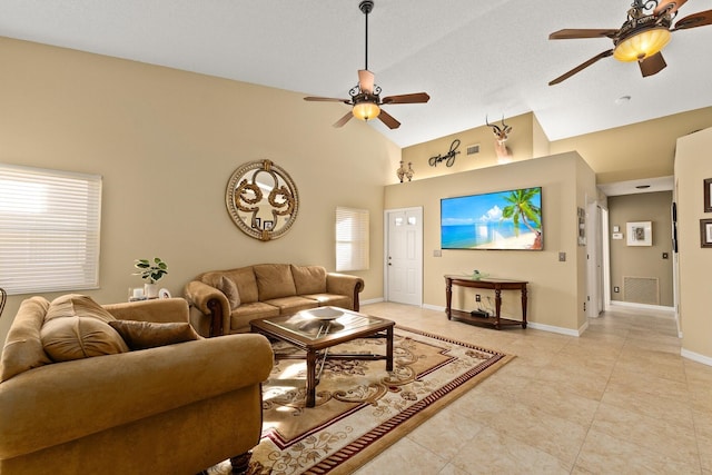 living room with light tile patterned floors, high vaulted ceiling, and ceiling fan