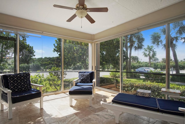 sunroom featuring a wealth of natural light and ceiling fan