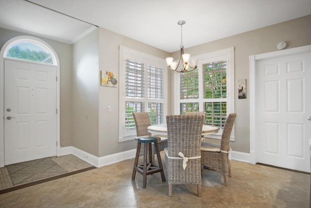 dining space with a notable chandelier and ornamental molding