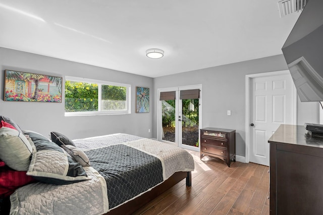 bedroom with dark hardwood / wood-style flooring