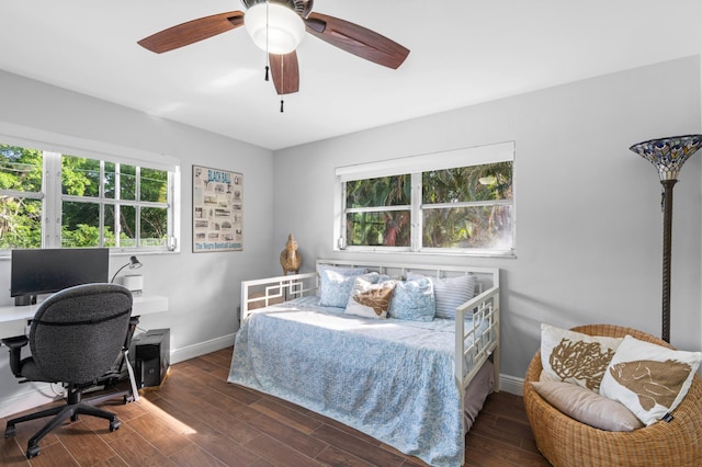 bedroom with dark wood-type flooring and ceiling fan