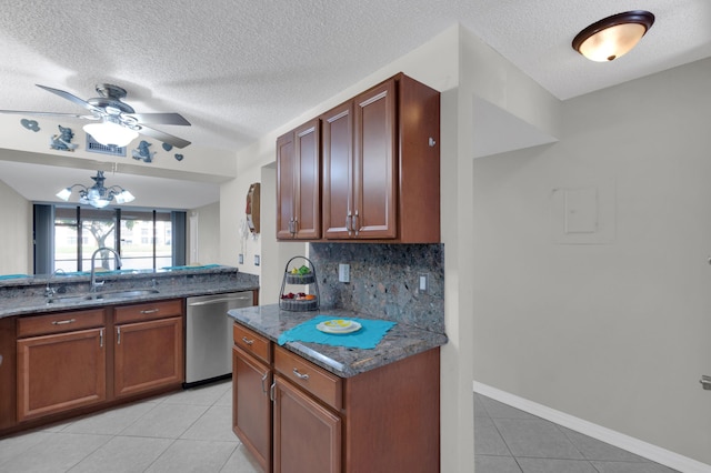 kitchen featuring sink, light tile patterned floors, dishwasher, decorative backsplash, and dark stone counters