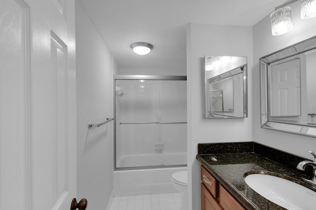 full bathroom featuring vanity, shower / bath combination with glass door, and toilet