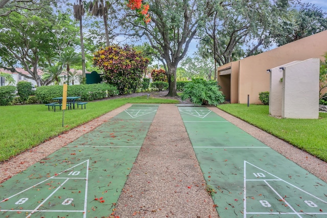 view of home's community featuring a lawn