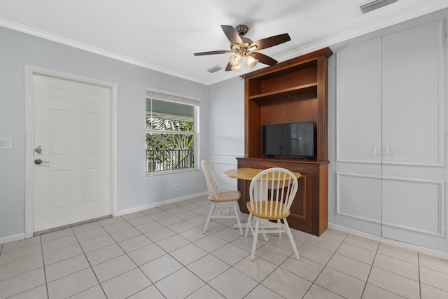 unfurnished office featuring crown molding, light tile patterned floors, and ceiling fan