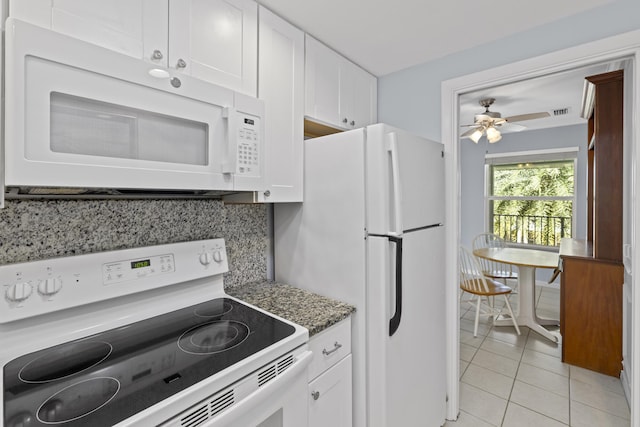 kitchen featuring decorative backsplash, white cabinets, white appliances, and ceiling fan