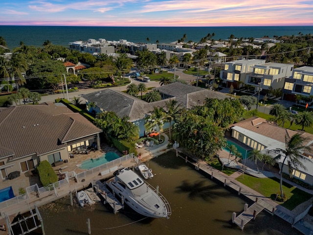 aerial view at dusk with a water view