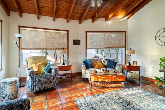 tiled living room with wood ceiling, ceiling fan, and a wealth of natural light