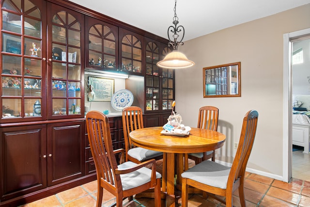 dining space featuring light tile patterned floors