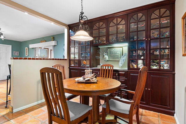 dining space featuring light tile patterned floors