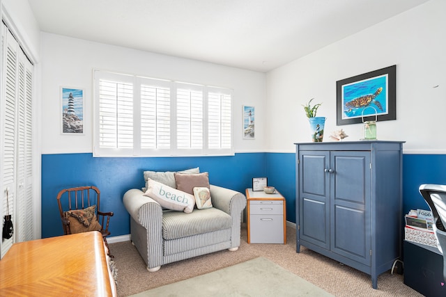 living area featuring carpet flooring