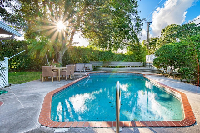 view of pool featuring a patio area