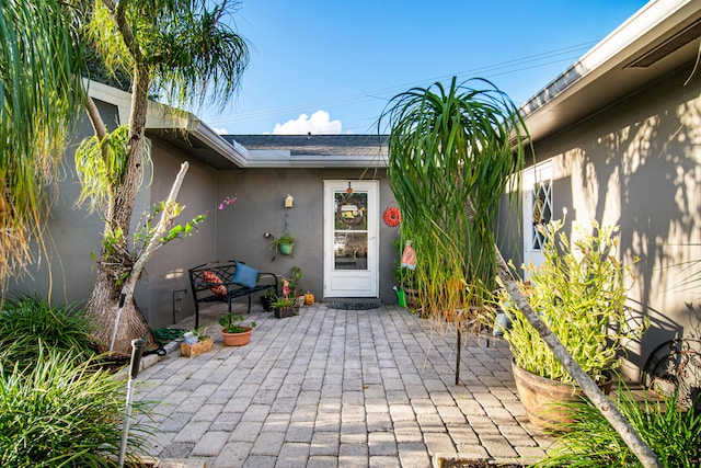 entrance to property with a patio