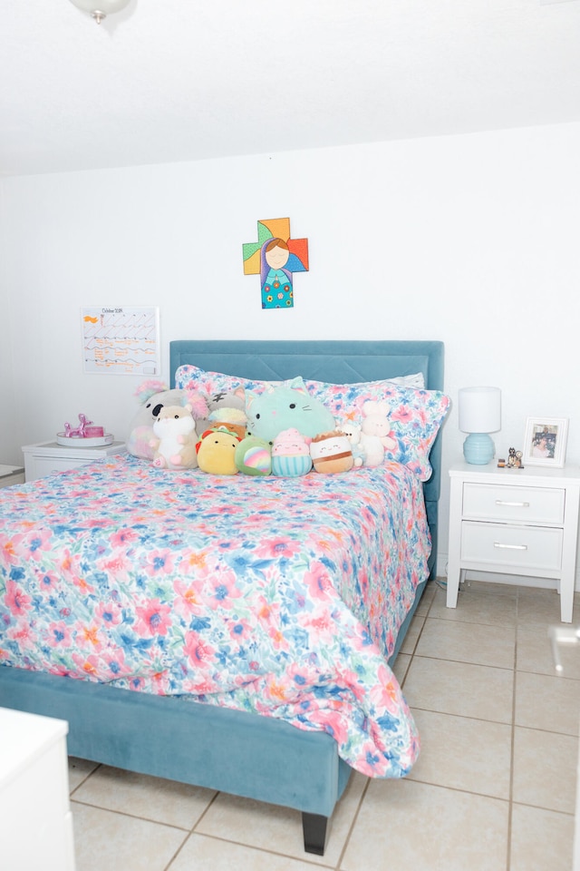 bedroom featuring light tile patterned floors