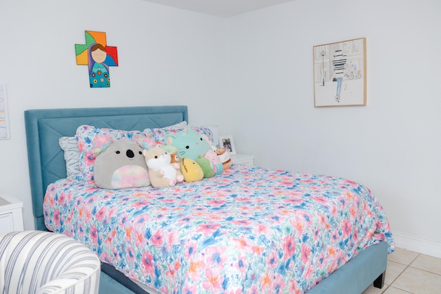 bedroom featuring light tile patterned flooring