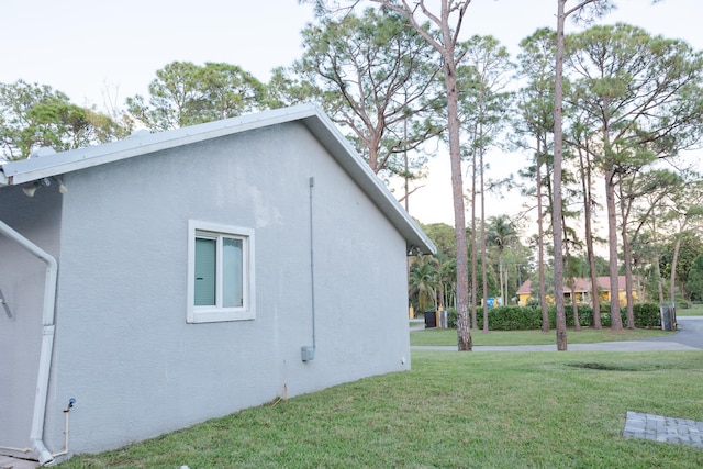 view of home's exterior featuring a lawn