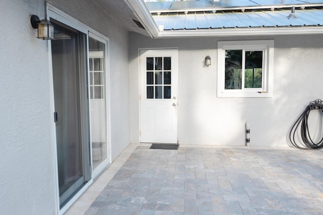 entrance to property with a patio area