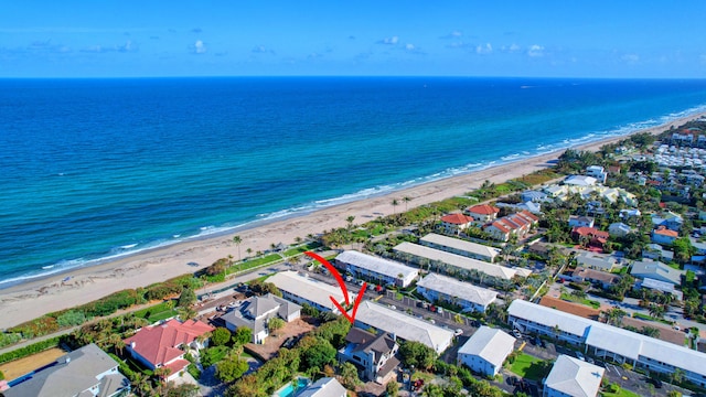 bird's eye view with a water view and a view of the beach