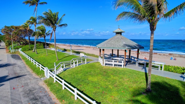 view of water feature featuring a gazebo and a beach view