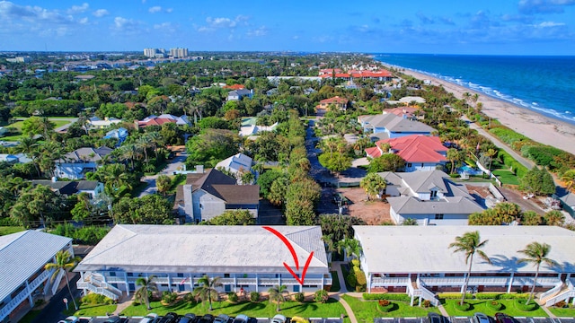 drone / aerial view with a view of the beach and a water view