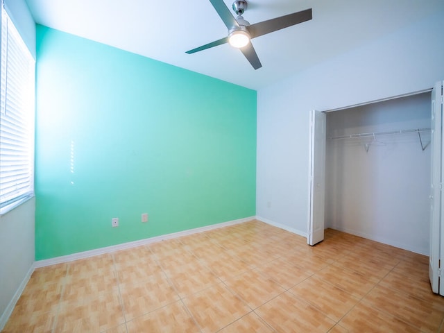 unfurnished bedroom with a closet and ceiling fan