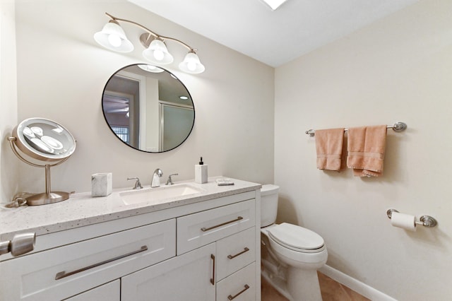 bathroom featuring toilet and vanity