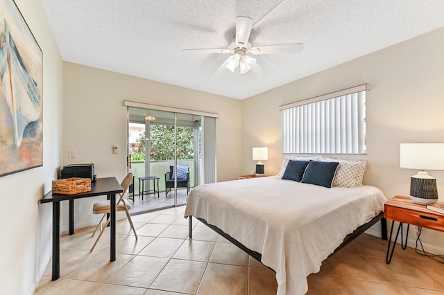 bedroom with a textured ceiling, light tile patterned flooring, access to exterior, and ceiling fan